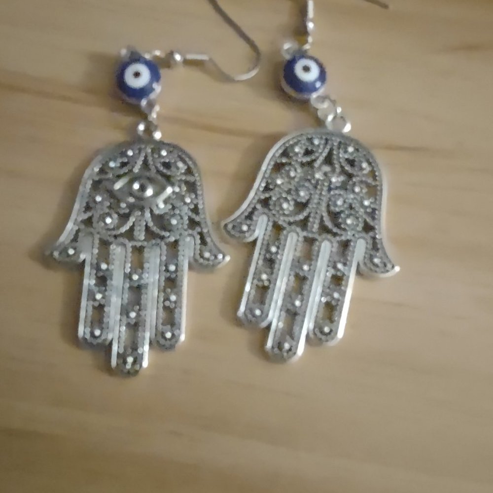 Dangling earrings - hamsa hands - in stainless steel